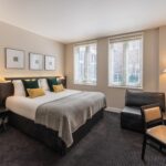 A superior room with a double bed and desk, located in Soho.