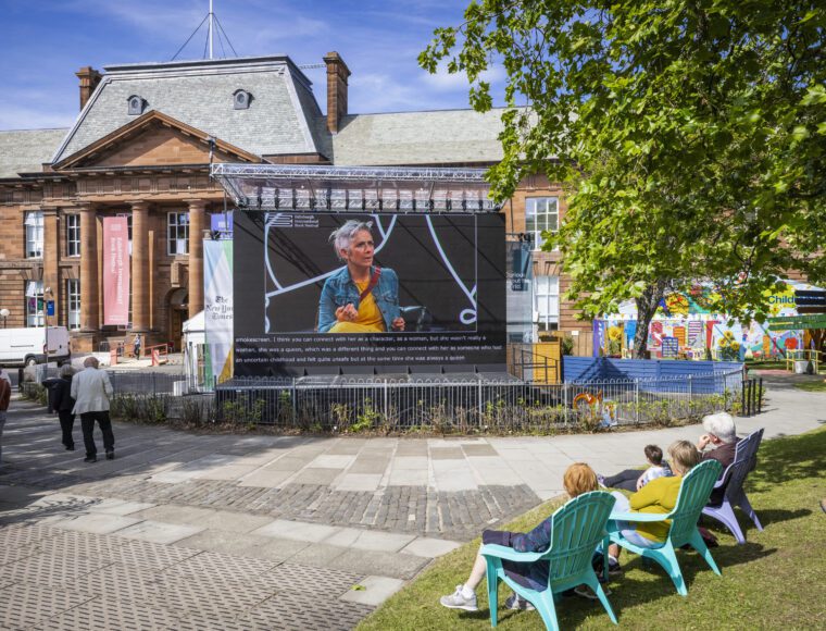 Guests reading outside at the Edinburgh International Book Festival
